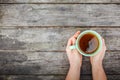 Woman hands holding mug of hot drink Royalty Free Stock Photo