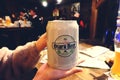 TOKYO,JAPAN - Ã¢â¬Å½DecemberÃ¢â¬Å½ Ã¢â¬Å½30Ã¢â¬Å½, Ã¢â¬Å½2017: woman hands holding mugs of japan beer in bar or restaurant at Japan Royalty Free Stock Photo