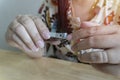 Woman hands holding nail clipper and cutting nails, cut nails concept Royalty Free Stock Photo