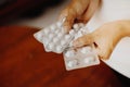 Woman hands holding packaged pills Royalty Free Stock Photo