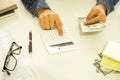 Woman hands holding paper money and calculator Royalty Free Stock Photo