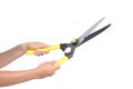 Woman hands holding a pruning shears