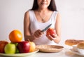 Woman hands holding red apple and knife on white background,Healthy diet,Dieting concept Royalty Free Stock Photo