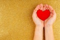 Woman Hands Holding Red Heart on Gold Background - Health care, Love Royalty Free Stock Photo