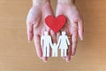 Woman hands holding red heart and icon family, health care, family insurance concept Royalty Free Stock Photo