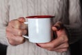 Cozy Winter Warmth: Nurturing Hot Drink Embraced by Comfortable Knits Royalty Free Stock Photo