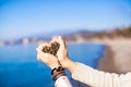 Woman hands holding small stones form heart shape Royalty Free Stock Photo