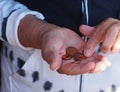 Woman hands holding some euro coins. Pension, poverty, social problems and senility theme