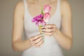 Woman hands holding spring flowers in an ice cream cone, sensual studio shot Royalty Free Stock Photo