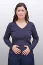 Woman hands holding stomach pain