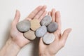 Woman hands holding stones. Concept for balance, combination, li Royalty Free Stock Photo