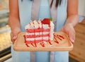 Woman hands holding strawberry cakes at cafe Royalty Free Stock Photo