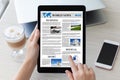 Woman hands holding tablet computer with app world news screen Royalty Free Stock Photo