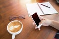 Woman hands holding touching mobile phone with blank copy space for your text message in cafe with light Sunset,Vintage tone Royalty Free Stock Photo