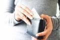 Woman hands holding US dollar bills in small wallet. Saving money concept Royalty Free Stock Photo