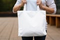 Woman hands holding white blank with copy space bag Royalty Free Stock Photo