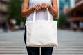 Woman hands holding white blank with copy space bag Royalty Free Stock Photo