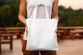 Woman hands holding white blank with copy space bag Royalty Free Stock Photo