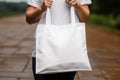 Woman hands holding white blank with copy space bag Royalty Free Stock Photo