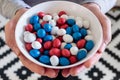 White bowl with red, white and blue peanut filled chocolate candy
