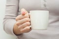 Woman hands holding white cup of tea or coffe Royalty Free Stock Photo