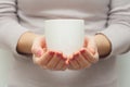 Woman hands holding white cup of tea or coffe Royalty Free Stock Photo