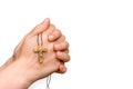 Woman hands holding wooden cross isolated on white Royalty Free Stock Photo