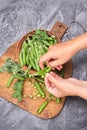 Woman hands hulled peas Royalty Free Stock Photo