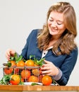 Woman hands with iron basket with fresh clementine copy space