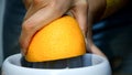 Woman hands juicing fresh orange fruit on juicer HD video. Prepa