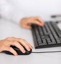 Woman hands with keyboard and mouse Royalty Free Stock Photo