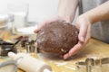 Woman hands kneading chocolate dough, cooking cookies or dessert. Cooking at home Royalty Free Stock Photo