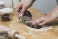 Woman hands kneading chocolate dough, cooking cookies or dessert. Cooking at home Royalty Free Stock Photo