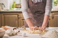 Woman hands kneading dough on kitchen table Royalty Free Stock Photo