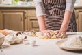 Woman hands kneading dough on kitchen table Royalty Free Stock Photo