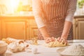 Woman hands kneading dough on kitchen table Royalty Free Stock Photo