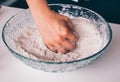 Woman hands kneading flour for making bread