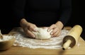 Woman hands kneading fresh dough for making bread or pizza. Royalty Free Stock Photo