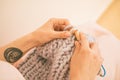 Woman hands knitting needles. hobby crafts things. Top view. Horizontal composition. Pink warm colors. New mainstream Royalty Free Stock Photo