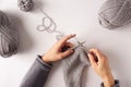 Woman hands knitting with needles and yarn