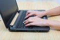 Woman hands on laptop telecommuting at home Royalty Free Stock Photo