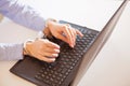 Woman hands locked to laptop by chain on keyboard of notebook