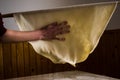 Woman hands making dough with long rolling pin