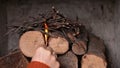 Woman hands making a fire - lighting the kindling