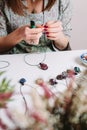 Woman hands making handmade gemstone jewellery Royalty Free Stock Photo