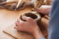 Woman hands making pot using clay in pottery studio Royalty Free Stock Photo