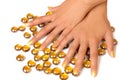Woman hands manicure with gold nail polish on white background