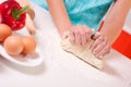 Woman hands mixing dough on the table Royalty Free Stock Photo