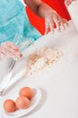 Woman hands mixing dough on the table