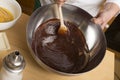 Woman hands mixing melted chocolate Royalty Free Stock Photo